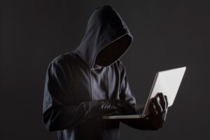 side view male hacker with gloves laptop 23 2148578161