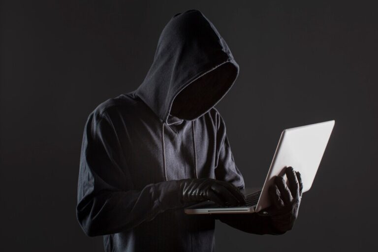 side view male hacker with gloves laptop 23 2148578161