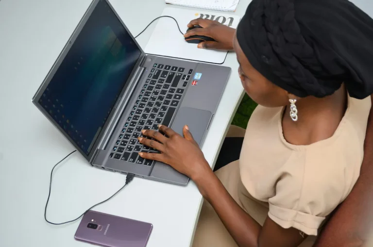 How to Get Started in Tech in 2026 Without Wasting Time or Money. A Beginner’s Guide to Graphic Design 14 Girl looking at her laptop