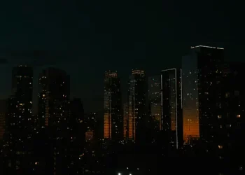 African city skyline partially darkened to represent internet shutdowns impacting digital infrastructure.