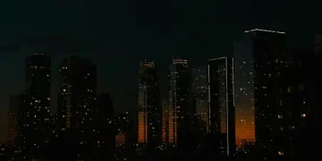 Techsoma Africa African city skyline partially darkened to represent internet shutdowns impacting digital infrastructure.