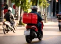 Techsoma Africa A delivery rider navigating traffic in an African city, where last-mile delivery costs run far higher than the global average