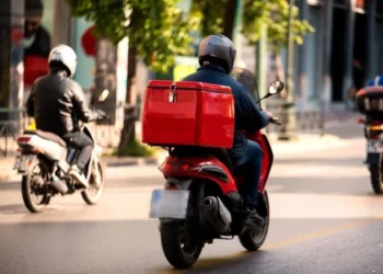 Techsoma Africa A delivery rider navigating traffic in an African city, where last-mile delivery costs run far higher than the global average