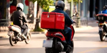 Techsoma Africa A delivery rider navigating traffic in an African city, where last-mile delivery costs run far higher than the global average