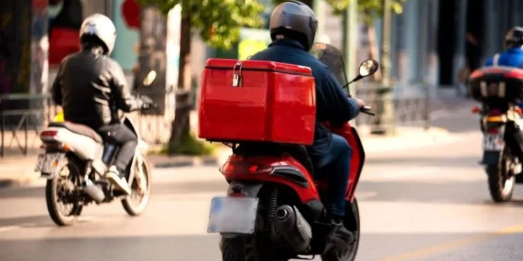 Techsoma Africa A delivery rider navigating traffic in an African city, where last-mile delivery costs run far higher than the global average