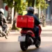 Techsoma Africa A delivery rider navigating traffic in an African city, where last-mile delivery costs run far higher than the global average