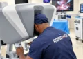 A picture of Professor Obi Ekwenna-Davis performing robotic surgery
