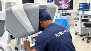 A picture of Professor Obi Ekwenna-Davis performing robotic surgery