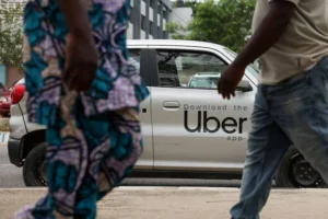 A ride-hailing driver in Lagos traffic, one of thousands affected by Uber's sudden departure from Nigeria