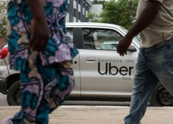A ride-hailing driver in Lagos traffic, one of thousands affected by Uber's sudden departure from Nigeria