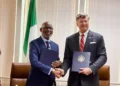 An image of a Nigerian minister and a US representative